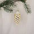 6cm guldig glansig kotte med vitt glitter - Julstämning.se