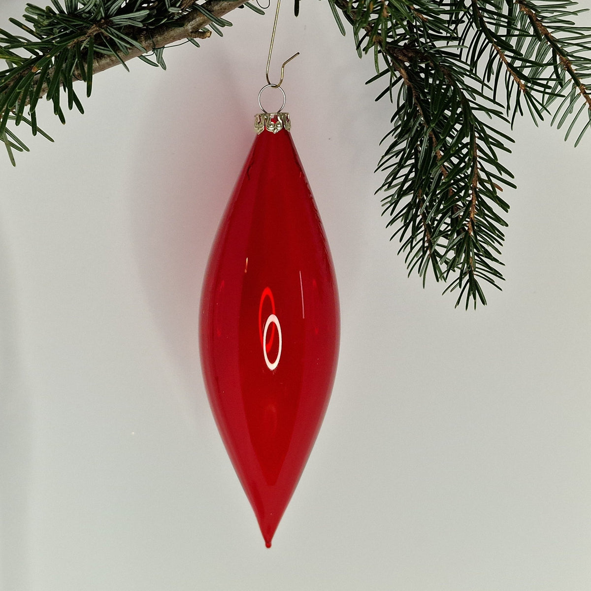 15cm transparent olivformad kula i rött - Julstämning.se